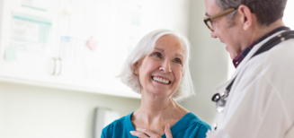 Doctor talking with a smiling patient