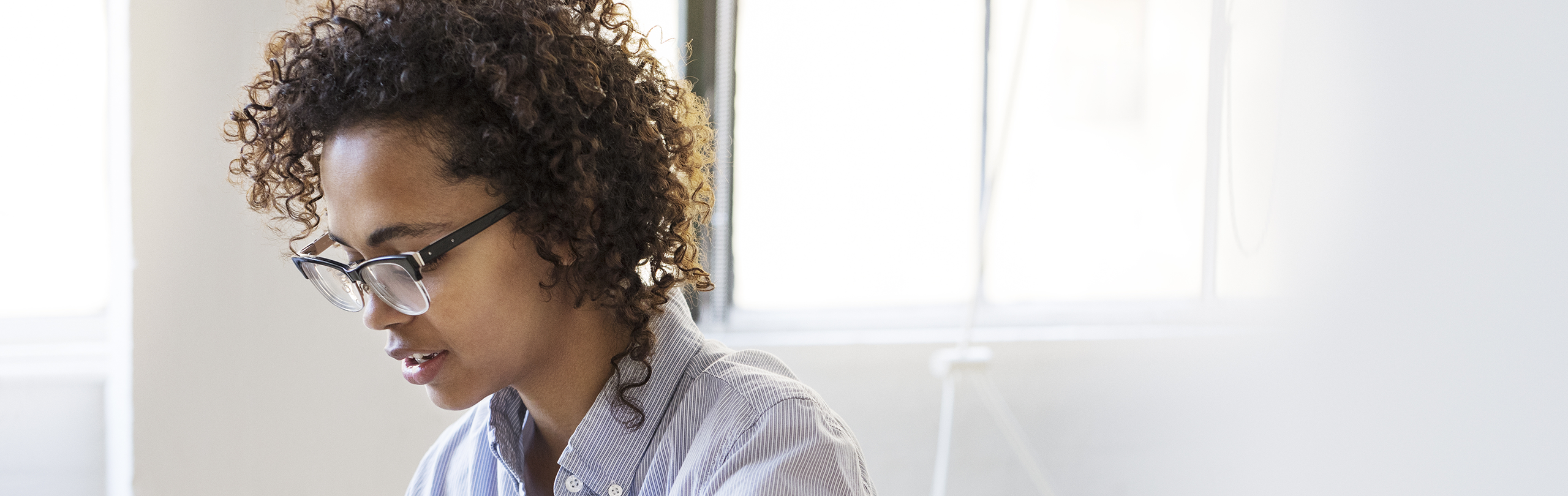 Woman sitting looking downwards