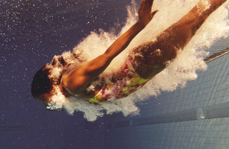 woman diving into pool