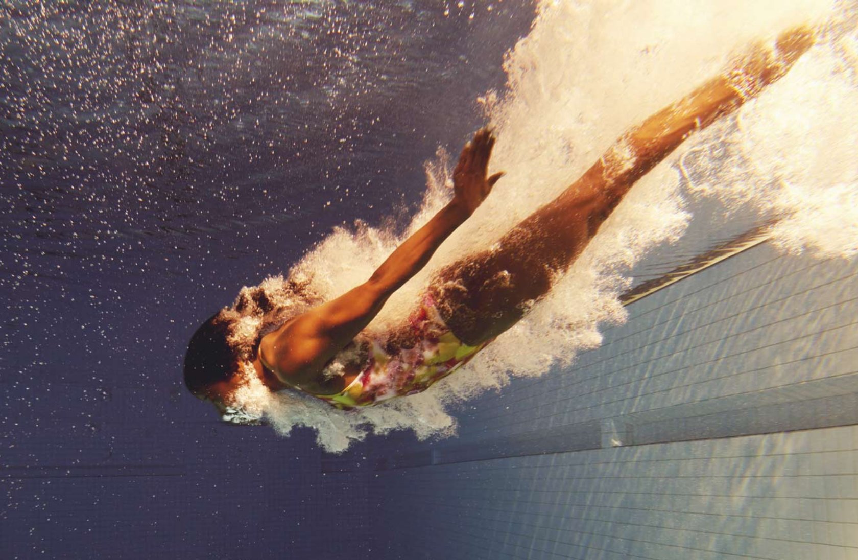 woman diving into pool