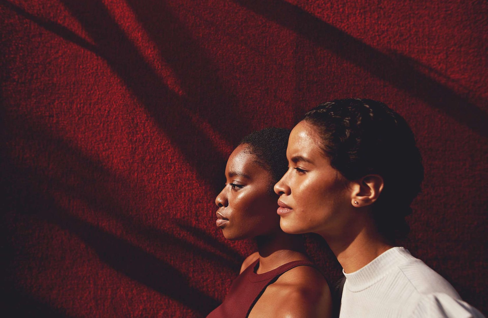 women together facing sun