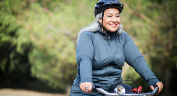 Person smiling while cycling