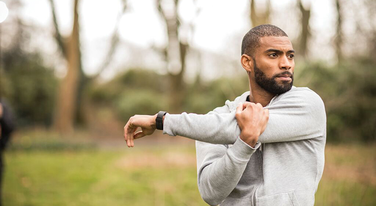 Man stretches in nature